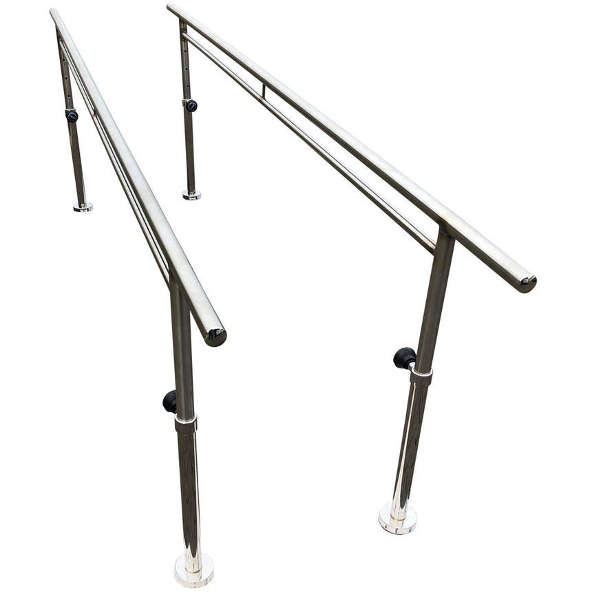 A pair of stainless steel parallel walking bars with adjustable height mechanisms and a bolt down fixed base, isolated on a white background.