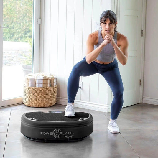 Power Plate Move vibration training platform in black set up for stepper exercises