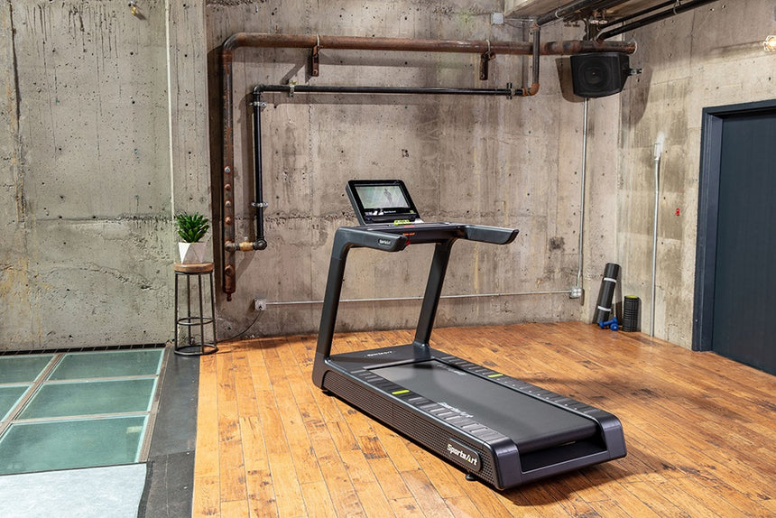 A black modern treadmill displayed in an indoor setting.
