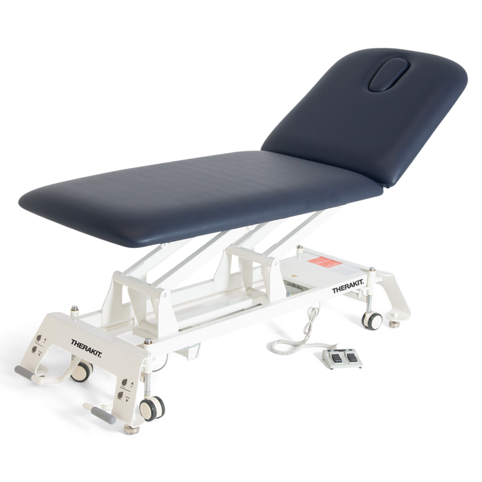 Therakit NEO 2 section treatment table finished in navy blue upholstery